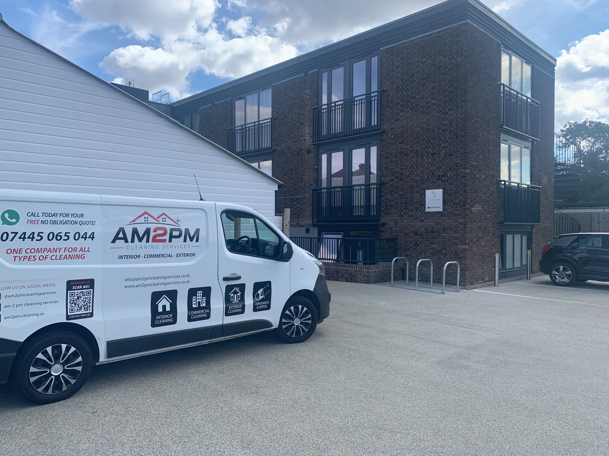 AM 2 PM Cleaning Services van outside commercial apartment block — communal area clean
