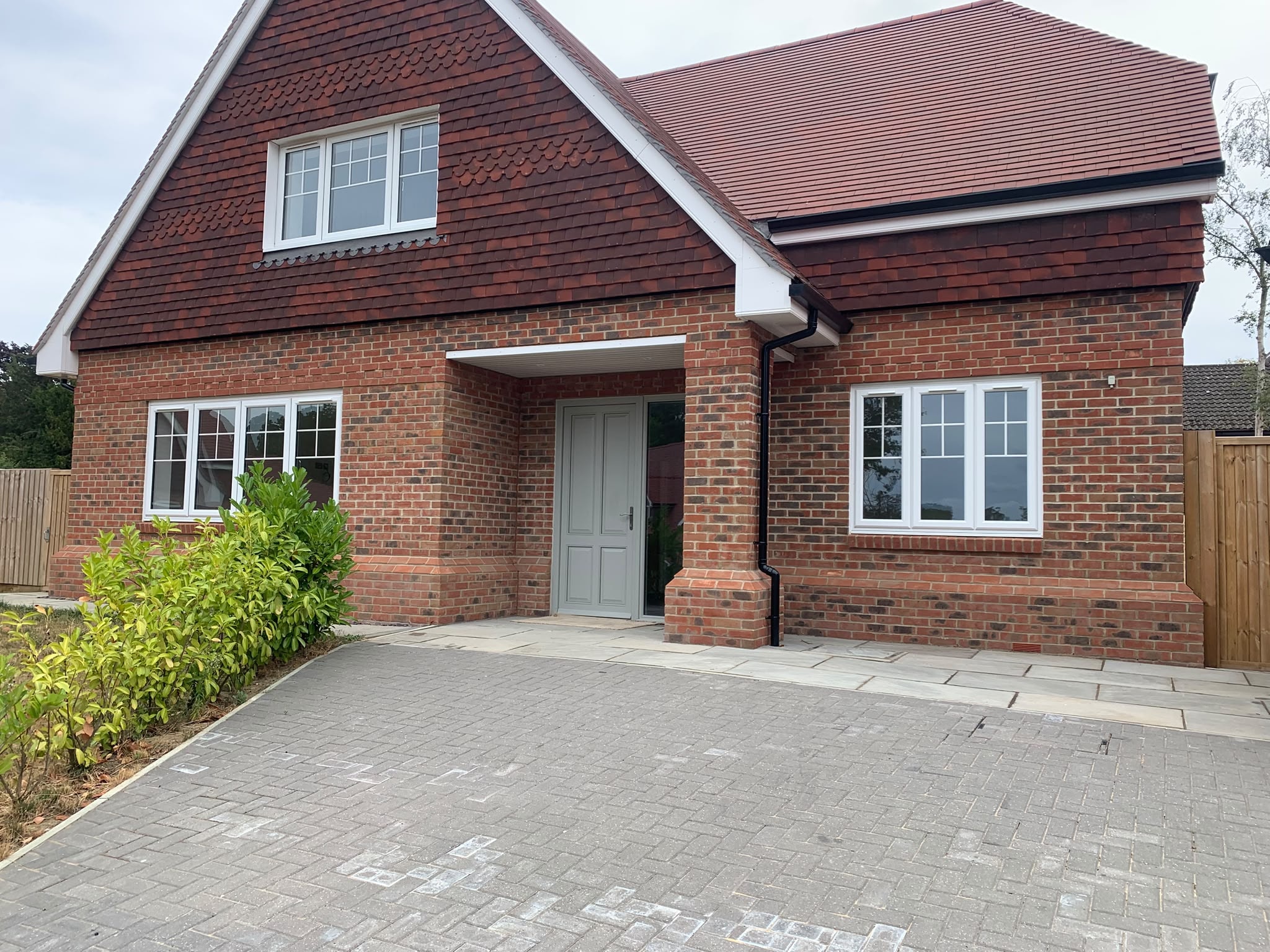 New build brick detached house exterior after builders clean — AM 2 PM Cleaning Services