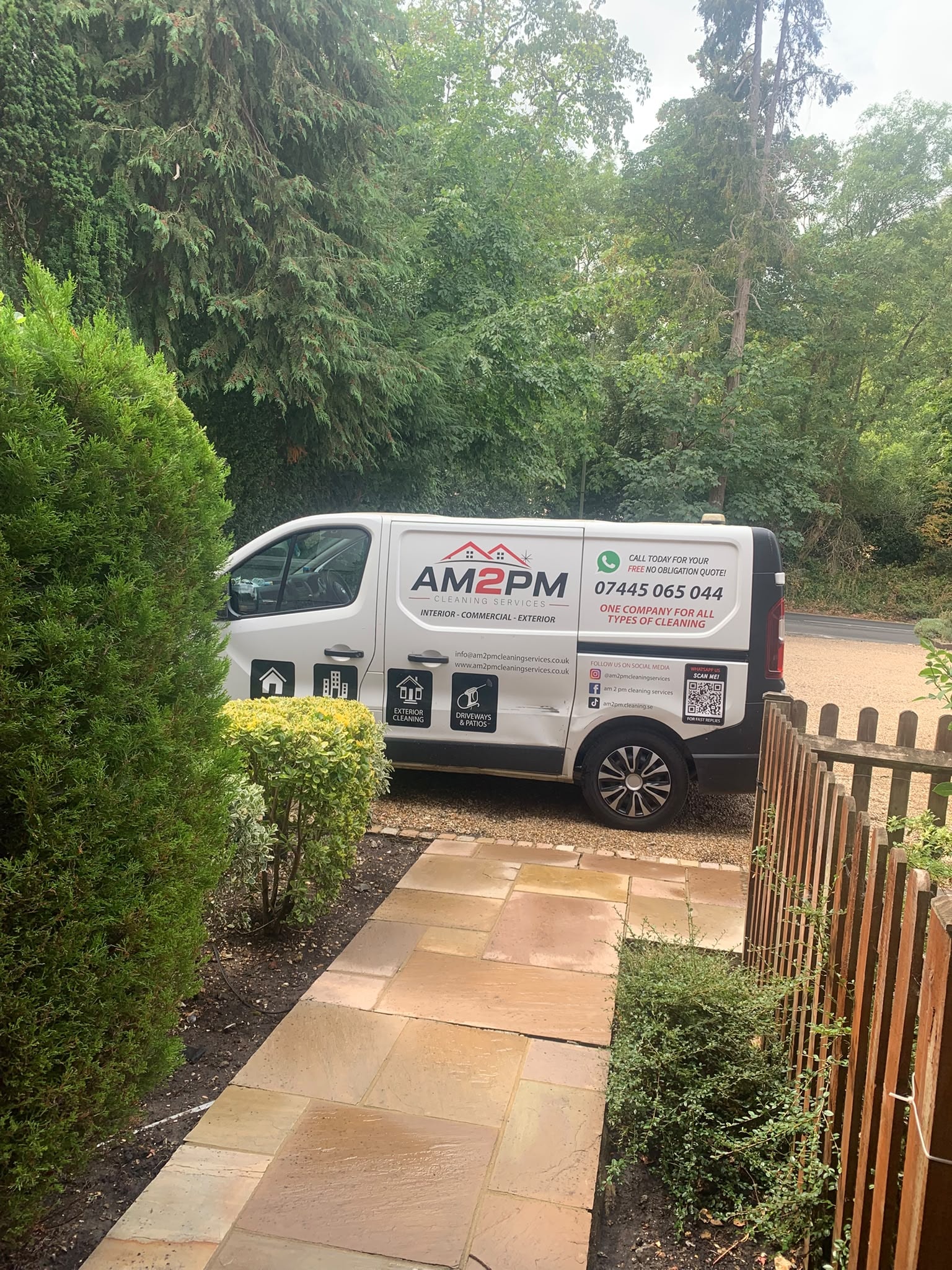 AM 2 PM Cleaning Services van parked at residential property with sandstone driveway