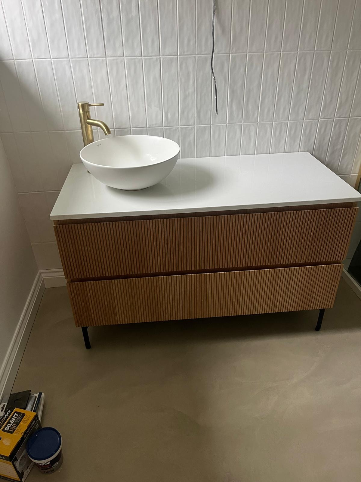 Modern oak vanity unit with vessel sink and brass tap — bathroom renovation Surrey