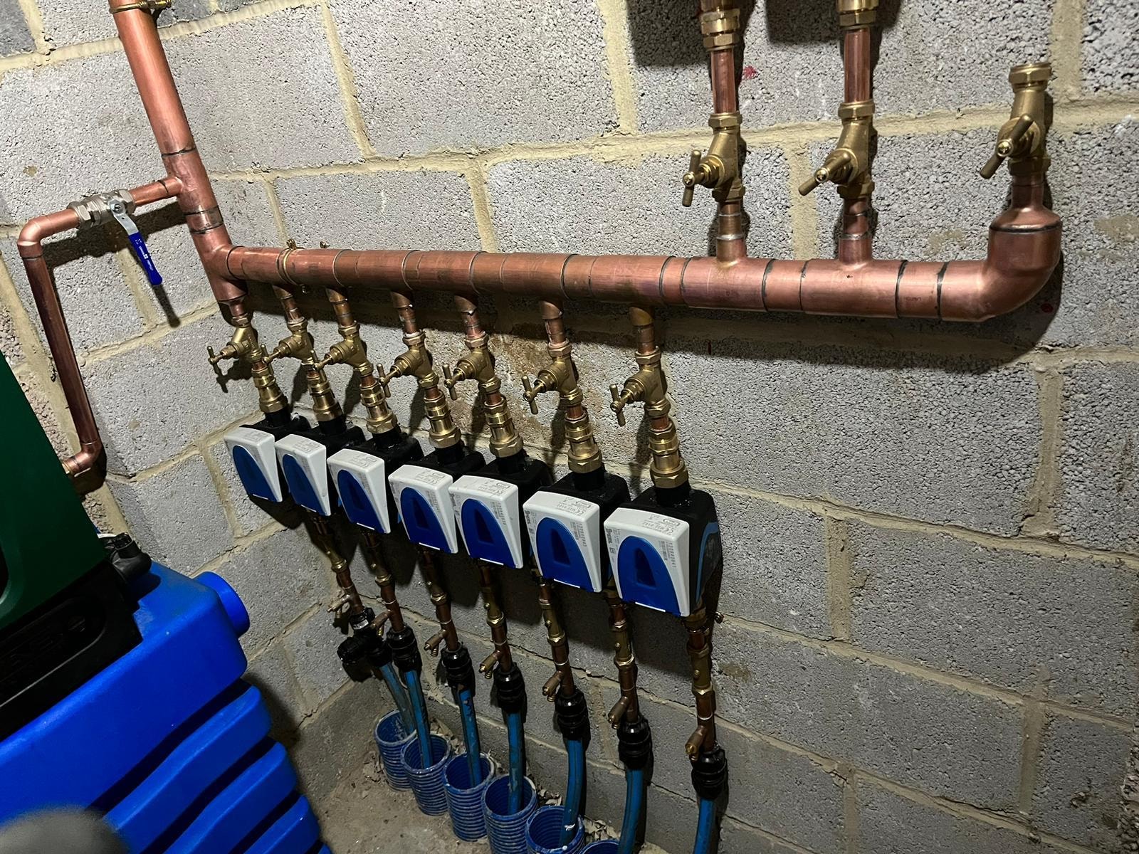 Copper pipe manifold with brass fittings for underfloor heating system — Surrey