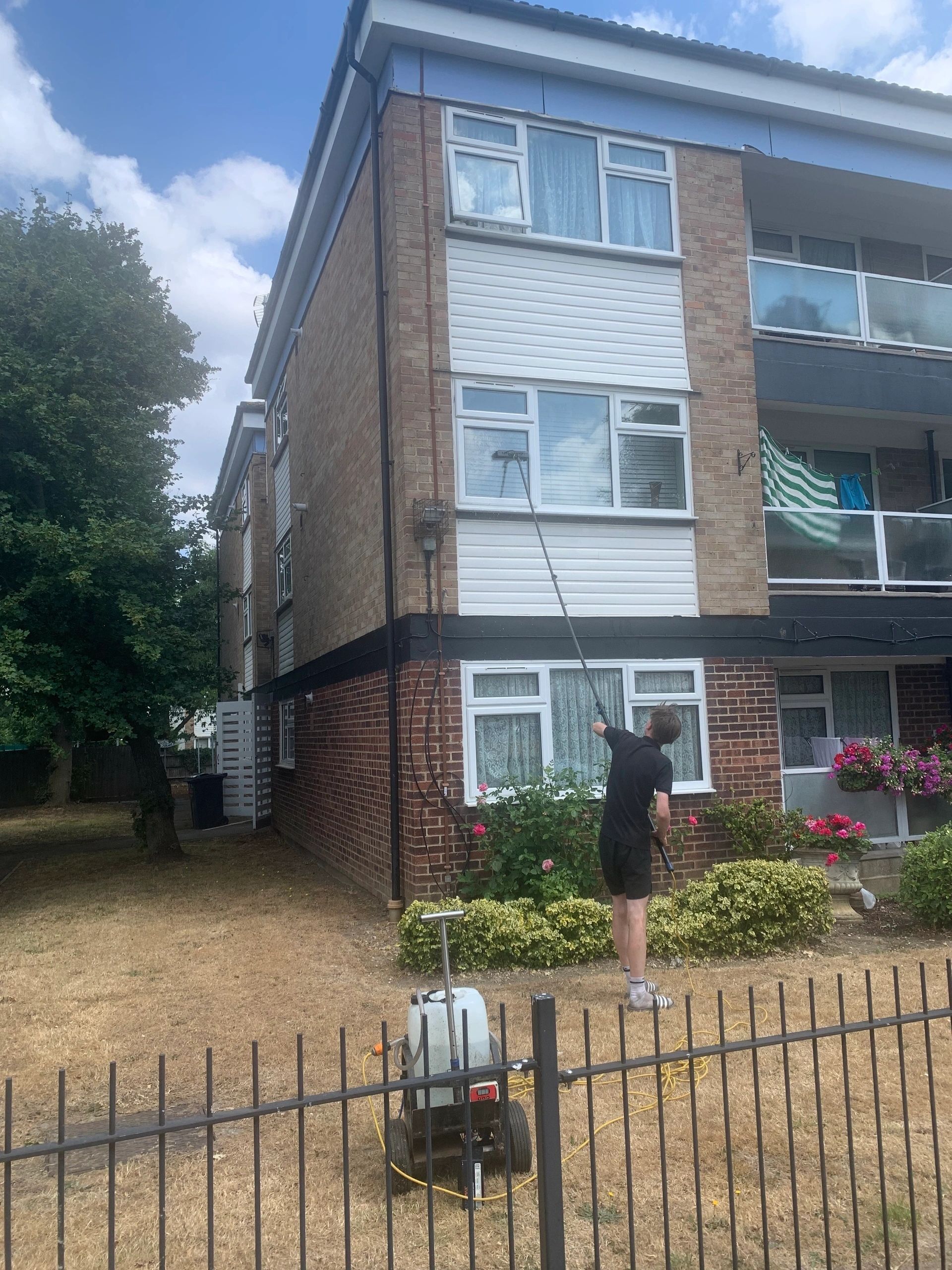 AM 2 PM operative carrying out professional exterior window cleaning